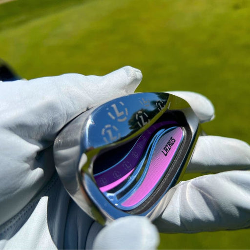 Lazrus women's cavity back iron club head held in hand showing cavity design